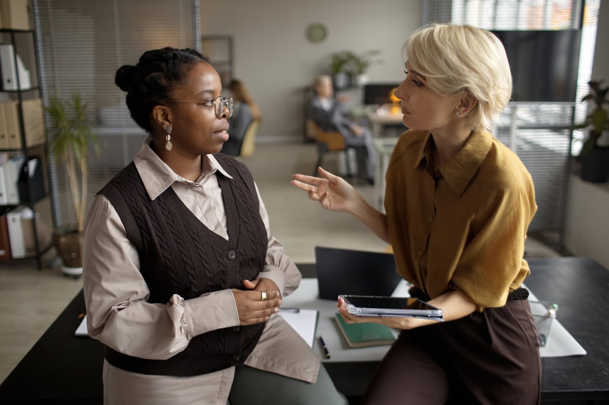 A HomeSafe team member being coached by an experienced colleague